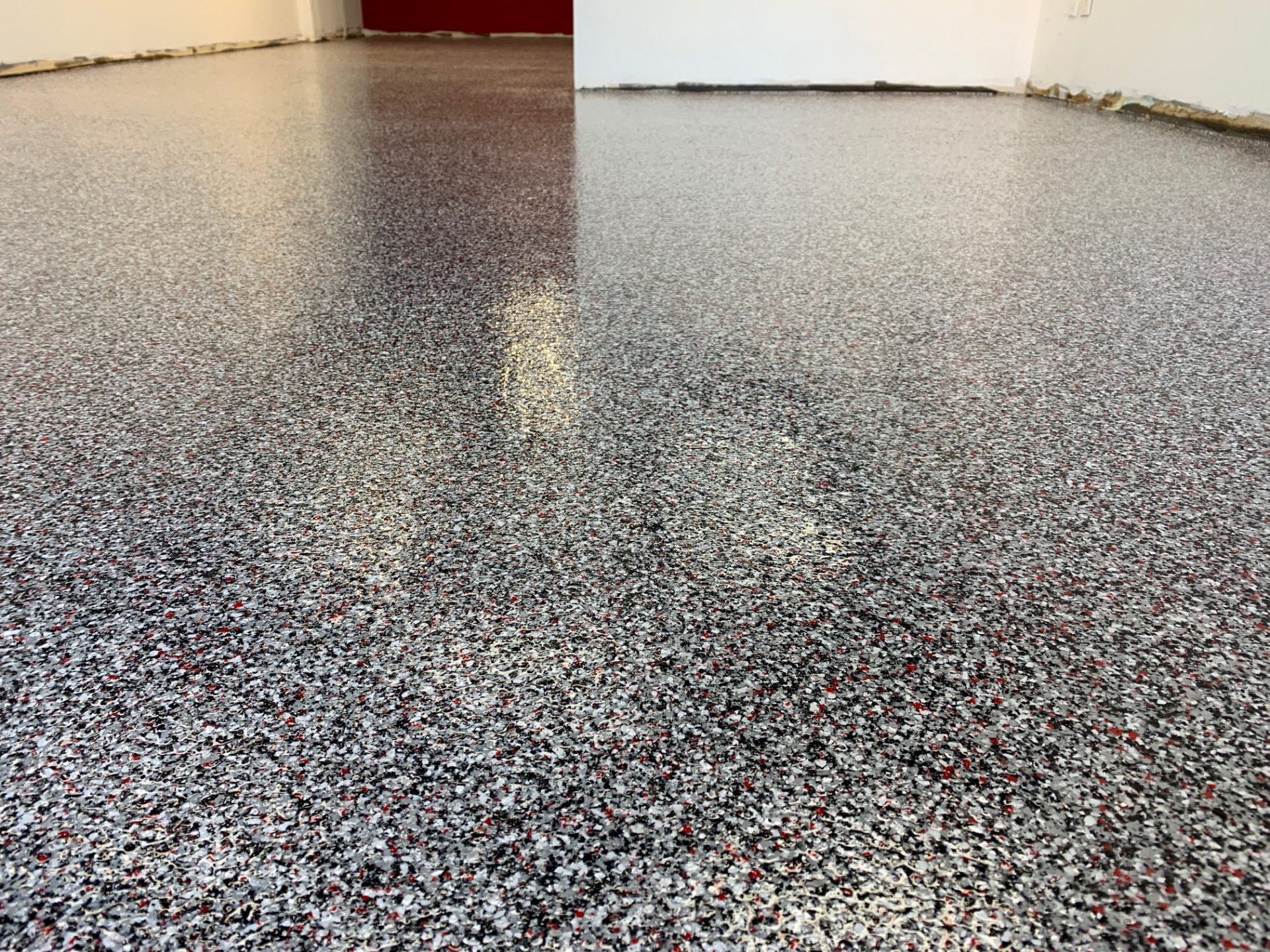 MVP Barbers - BTF Concrete Services - Concrete underlay over existing VCT. Sealed with a poly aspartic chip system.